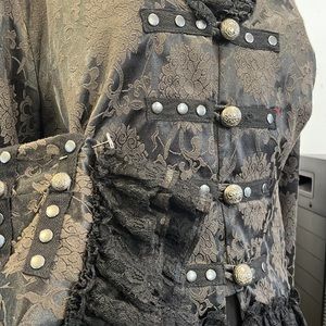 Black jacket with corset in the back . size 12 but can extend